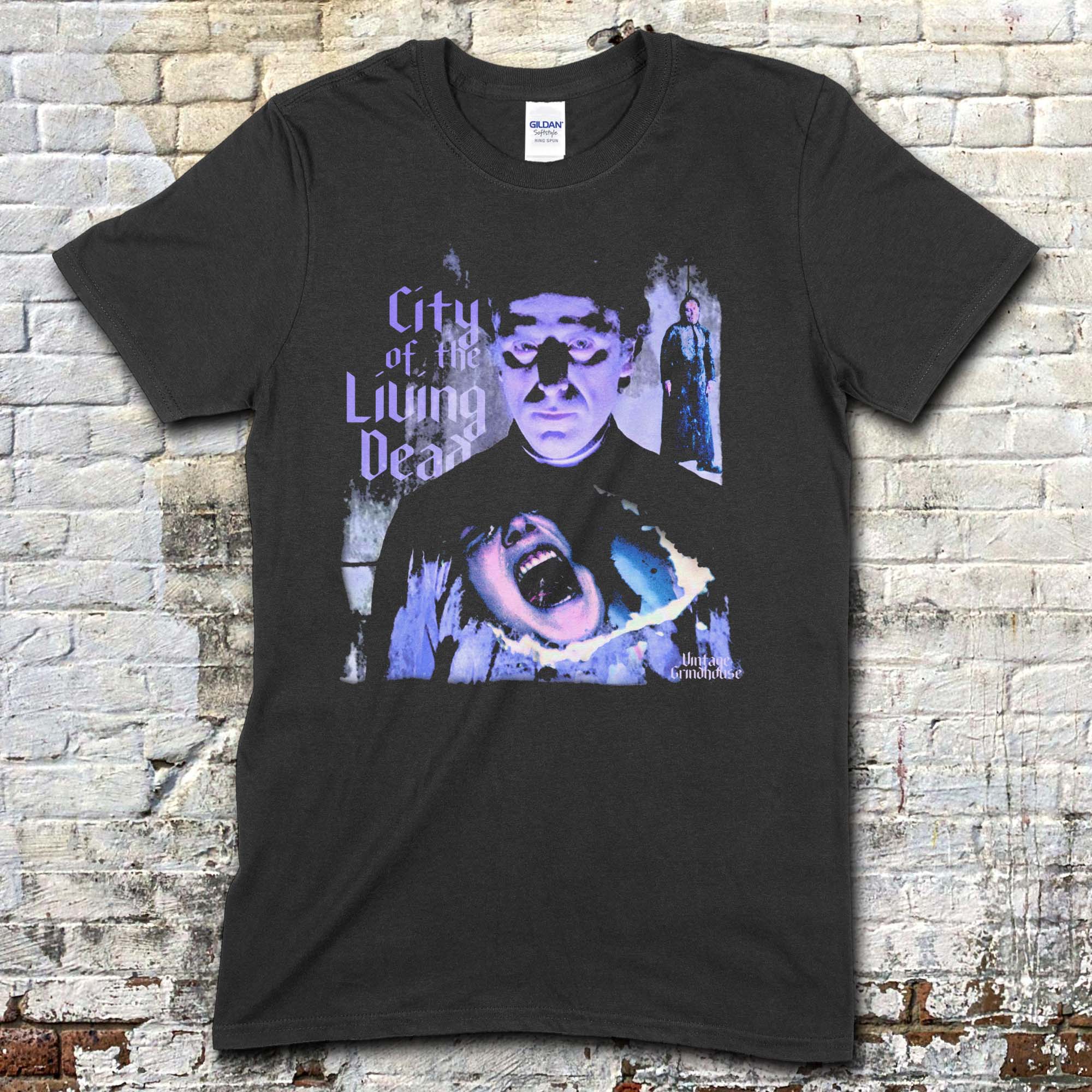 Black t-shirt featuring a blue-toned graphic of a man with a screaming face and City of the Living Dead text on front