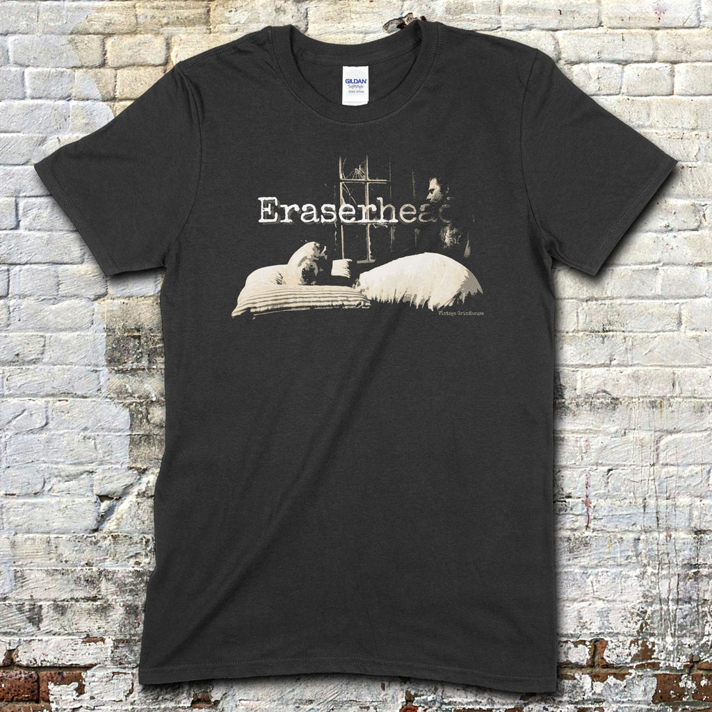Black t-shirt with vintage-inspired Eraserhead Baby graphic showing surreal figure and dimly lit bedroom scene