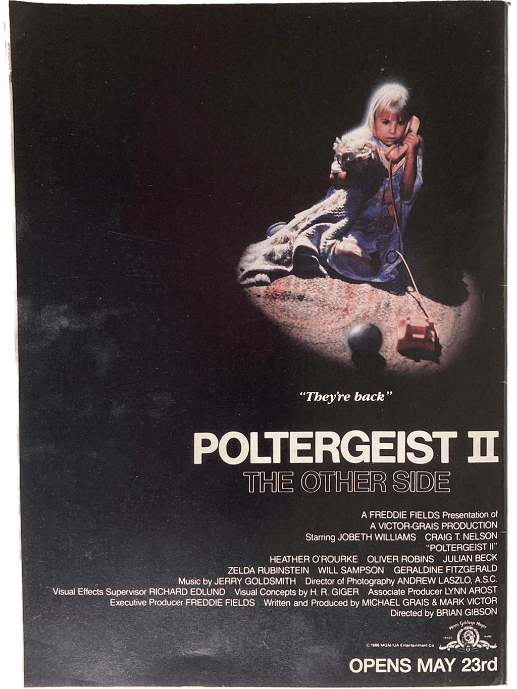 Fangoria Magazine #54 cover featuring Poltergeist II poster with a child holding a toy phone in a dark scene