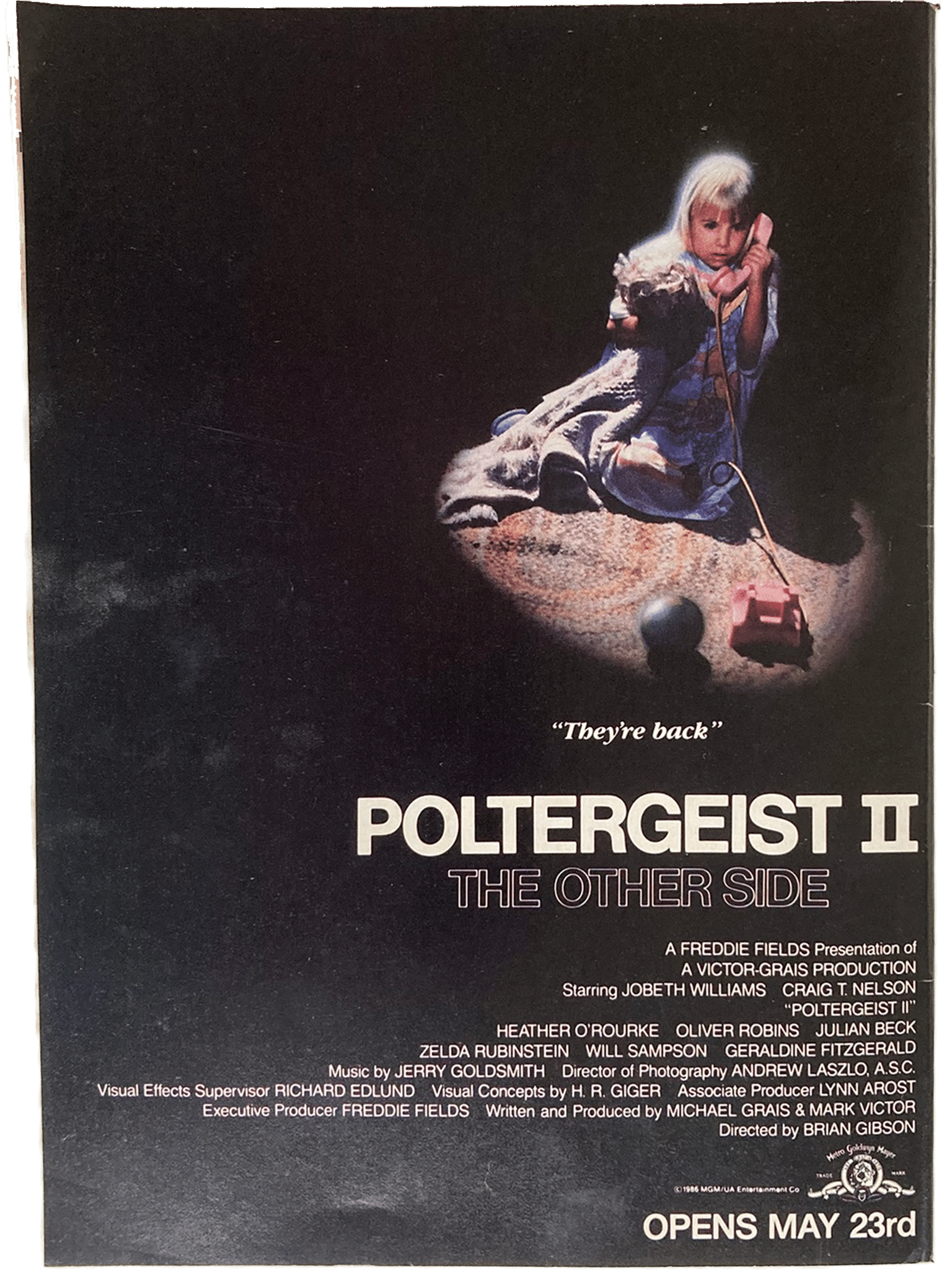 Fangoria Magazine #54 cover featuring Poltergeist II poster with a child holding a toy phone in a dark scene
