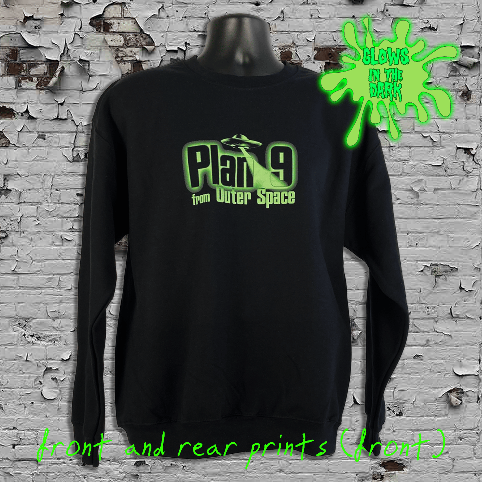 Black long-sleeve shirt with 'Plan 9 from Outer Space' graphic on a textured wall background