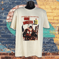 T-shirt with 'Robot Monster 30' design on a mannequin against a colorful brick wall background