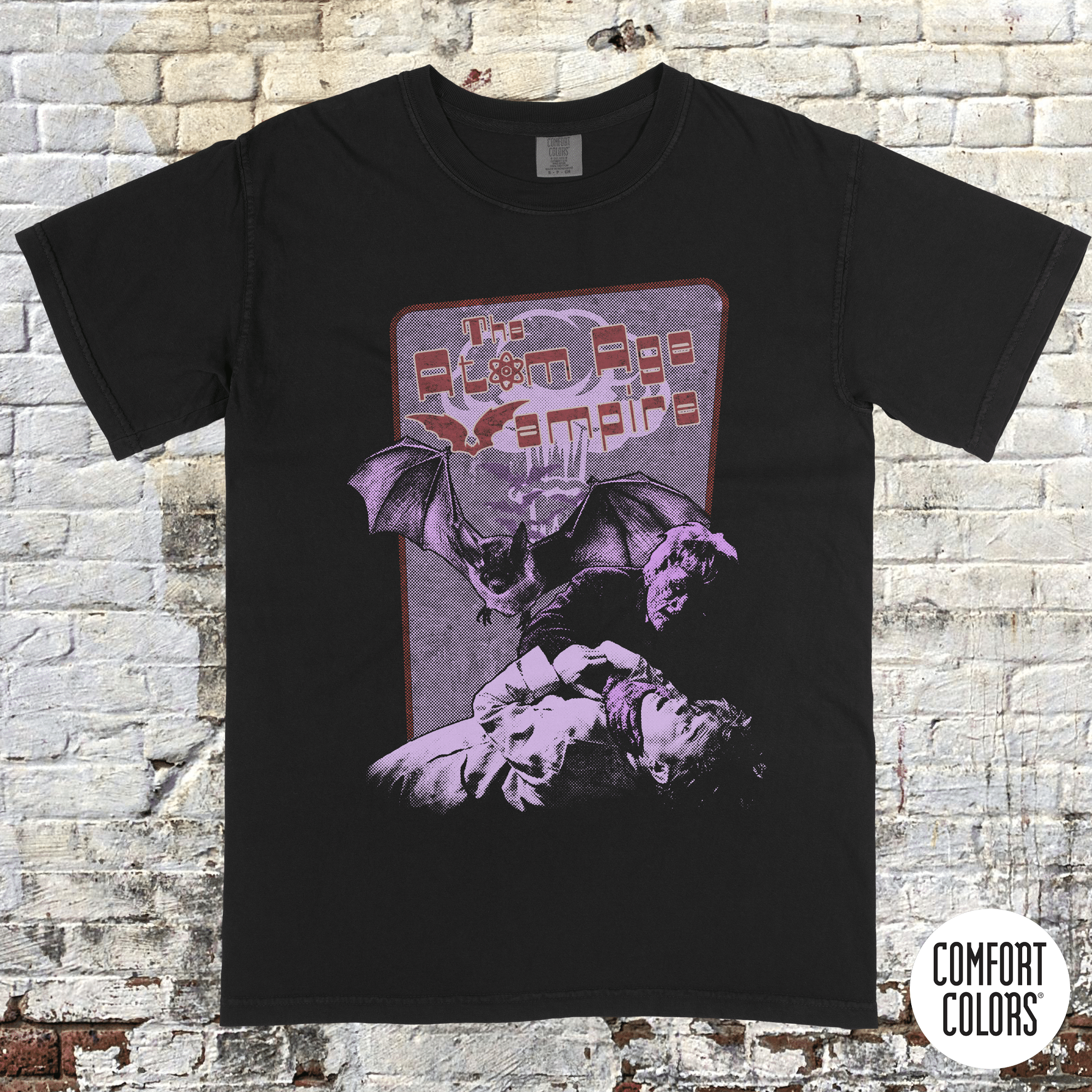 Atom Age Vampire t-shirt design featuring vintage horror art with bats and a distressed purple and red print on black.