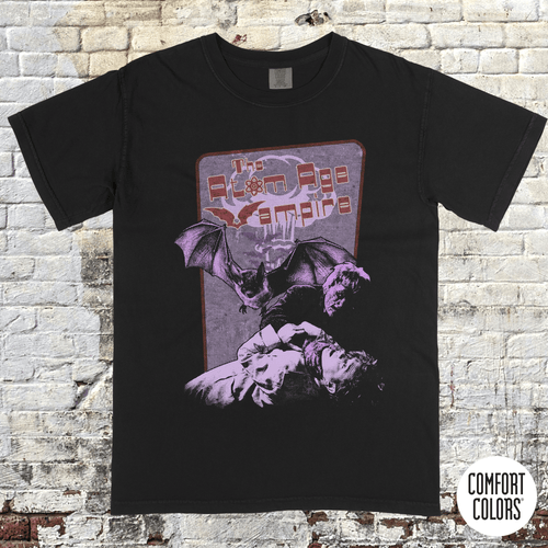 Atom Age Vampire t-shirt design featuring vintage horror art with bats and a distressed purple and red print on black.