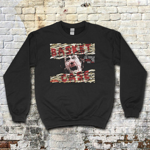 Basket Case sweatshirt with distressed graphic of a screaming face and torn text on black fabric background