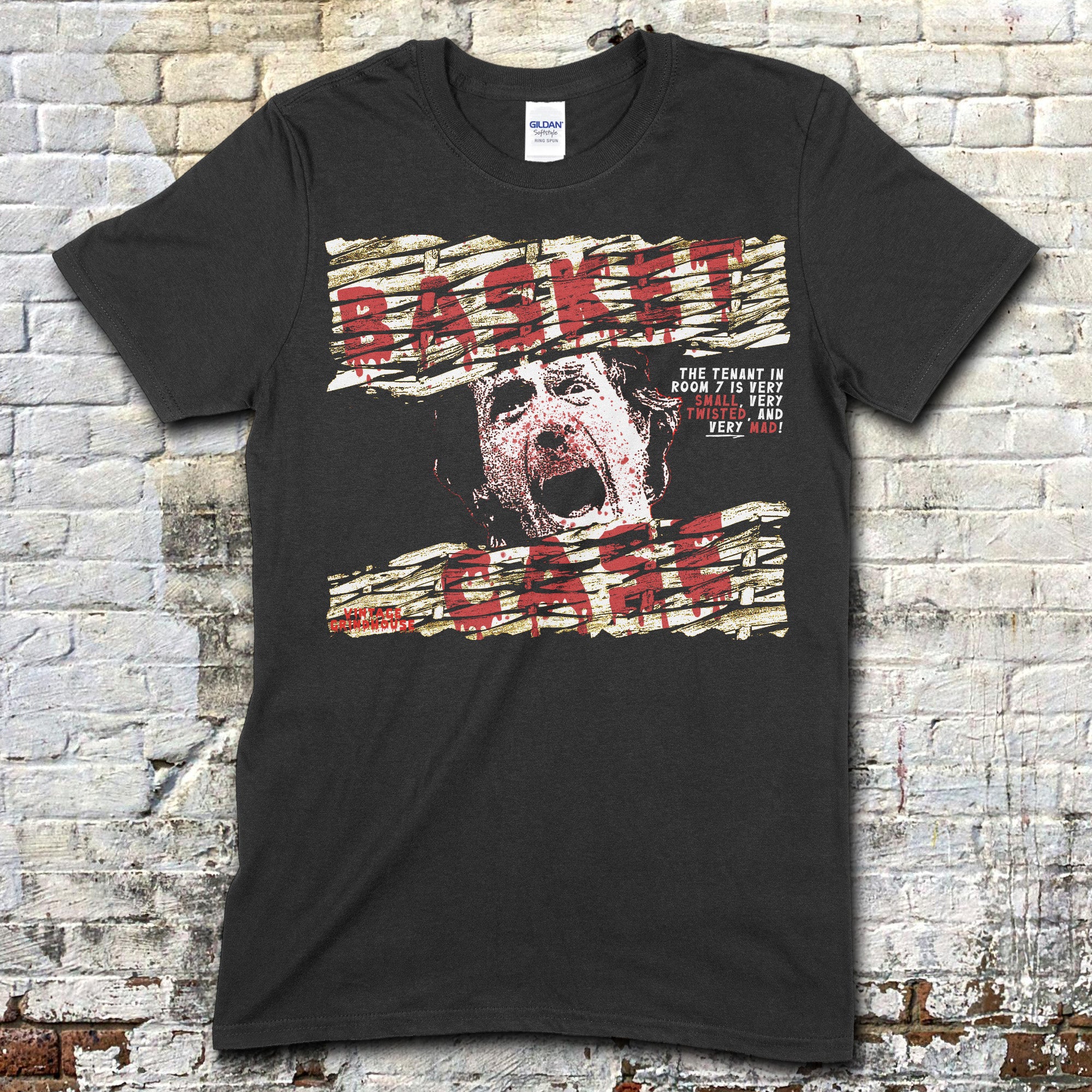Black t-shirt featuring distressed wood plank graphic with screaming face and red Basket Case text on front