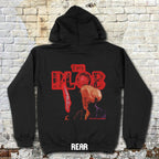 Black hoodie with 'The Blob' graphic design on a brick wall background