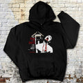 Black hoodie with graphic design on a textured brick wall background