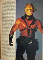 Person in a costume with a mask and leather harness against a book page background