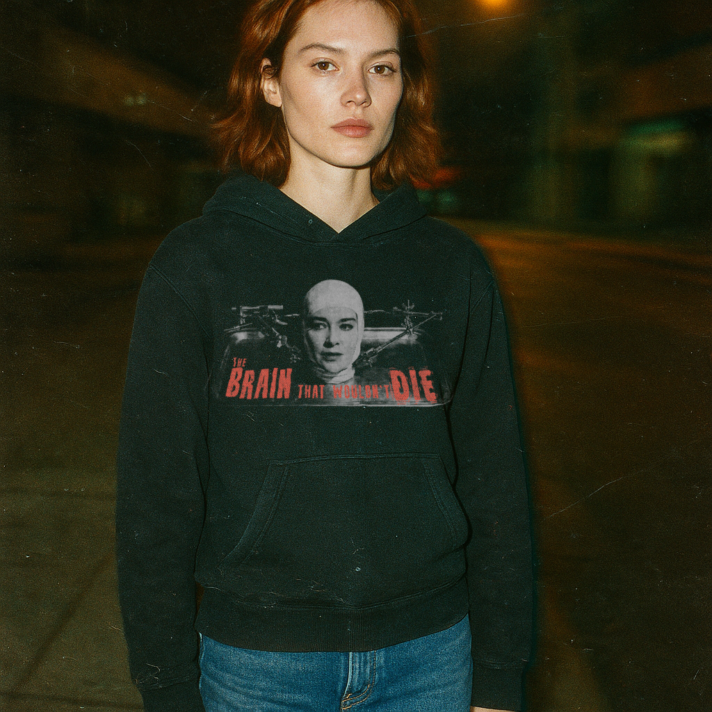 Model wearing black hoodie featuring vintage grindhouse style design with "The Brain That Wouldn't Die t-shirt" horror art and text.