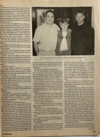 Page from a book or magazine with a photograph of three people and text on a light brown background.