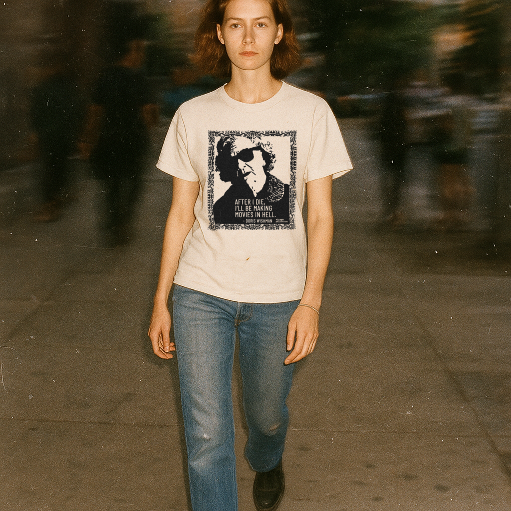 Person wearing a t-shirt with a graphic design on a blurred street background