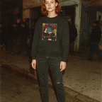 Ms. 45 - Pulp Edition #1 sweatshirt with vintage comic cover print worn by woman on urban nighttime street scene