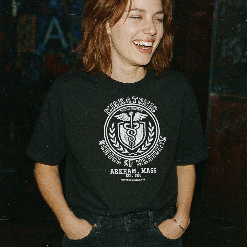 Person wearing a black t-shirt with 'Miskatonic School of Medicine' design