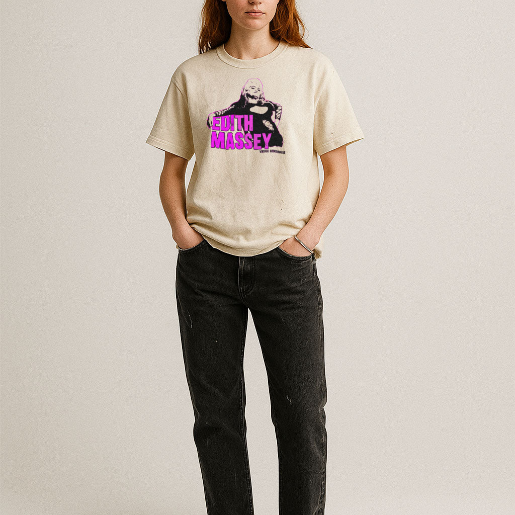 Person wearing a beige t-shirt with a graphic design and text on a plain background