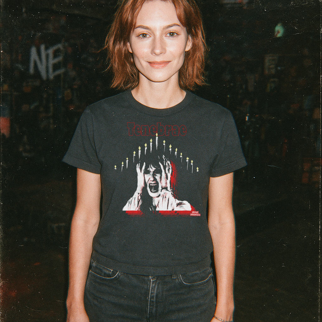 Person wearing a black t-shirt with a graphic design of a woman's face and candles.