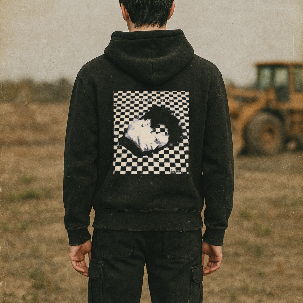 Person wearing Eraserhead - front and rear prints! hoodie showing surreal black and white checkered rear graphic outdoors