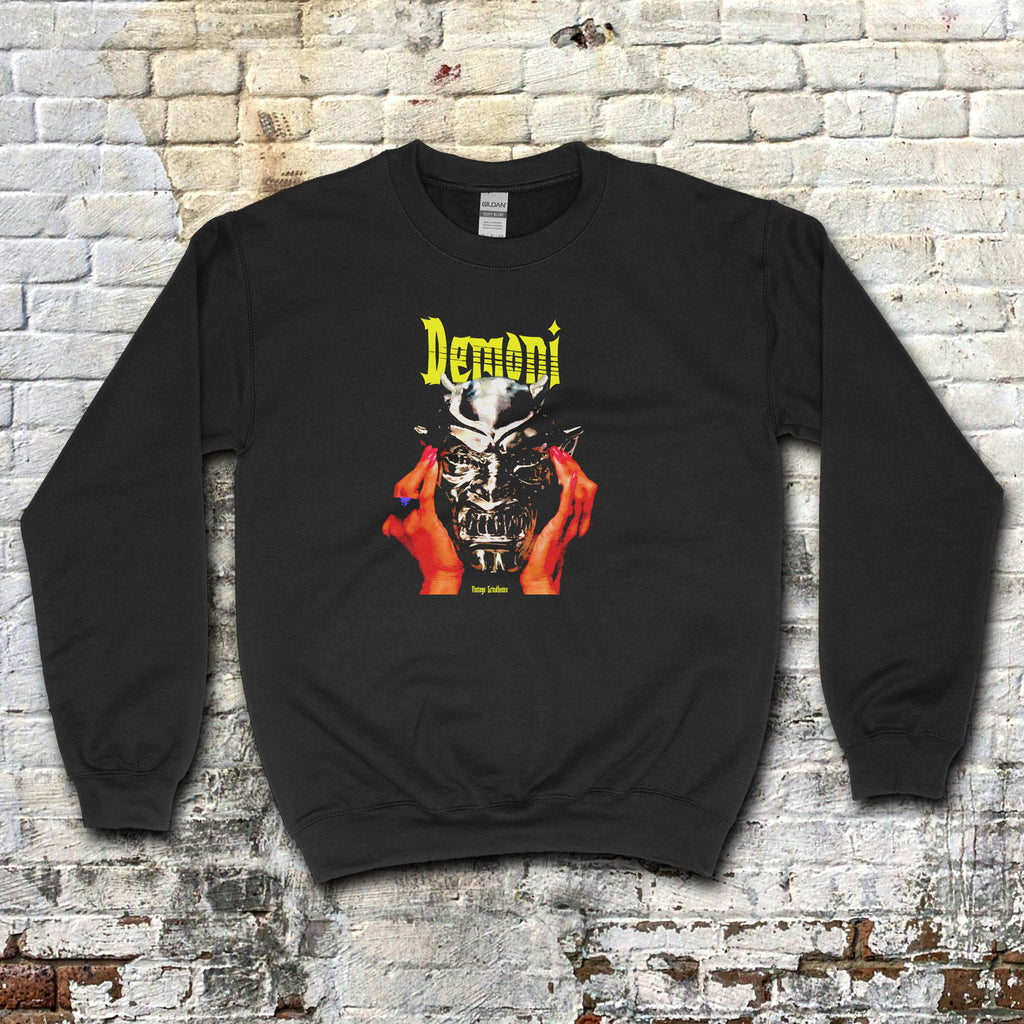 Black Demoni aka Demons sweatshirt with vivid graphic of red hands holding a silver demonic mask and yellow text