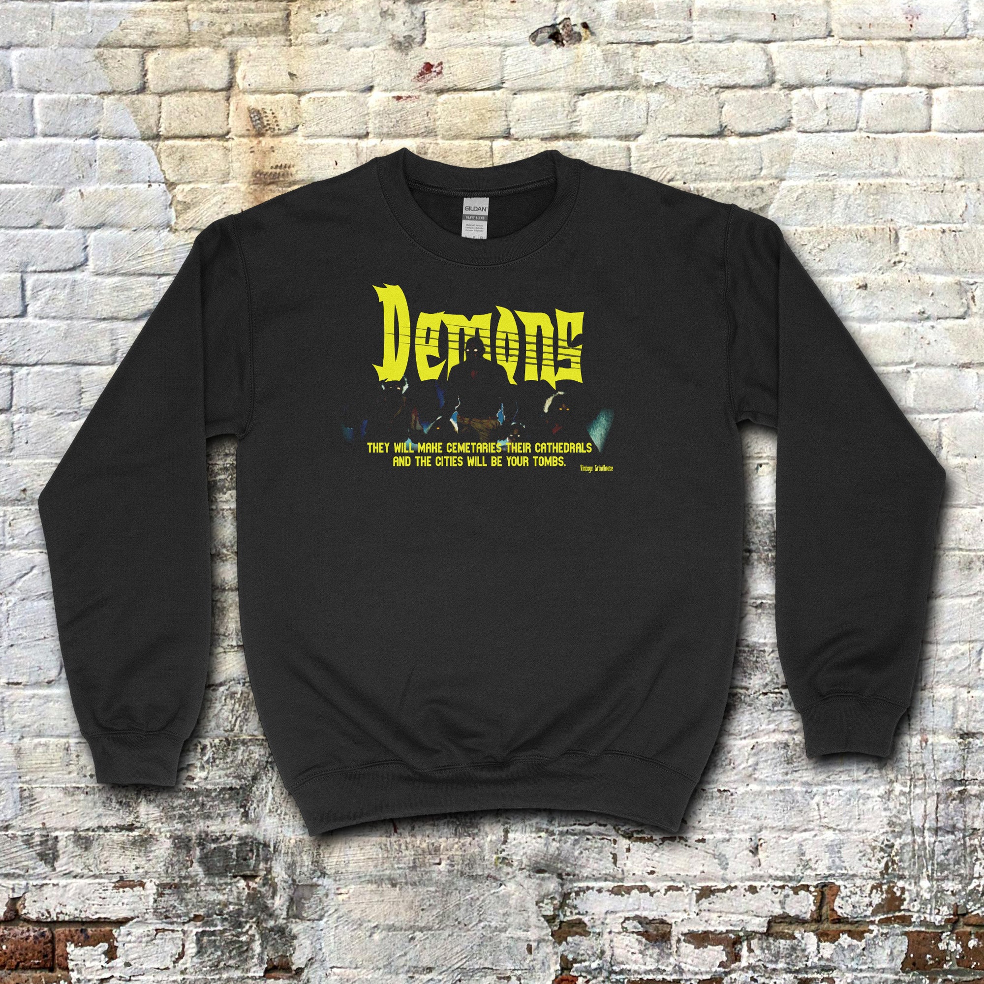 Demons aka Demoni sweatshirt with bright yellow gothic text and dark mysterious silhouette on black fabric