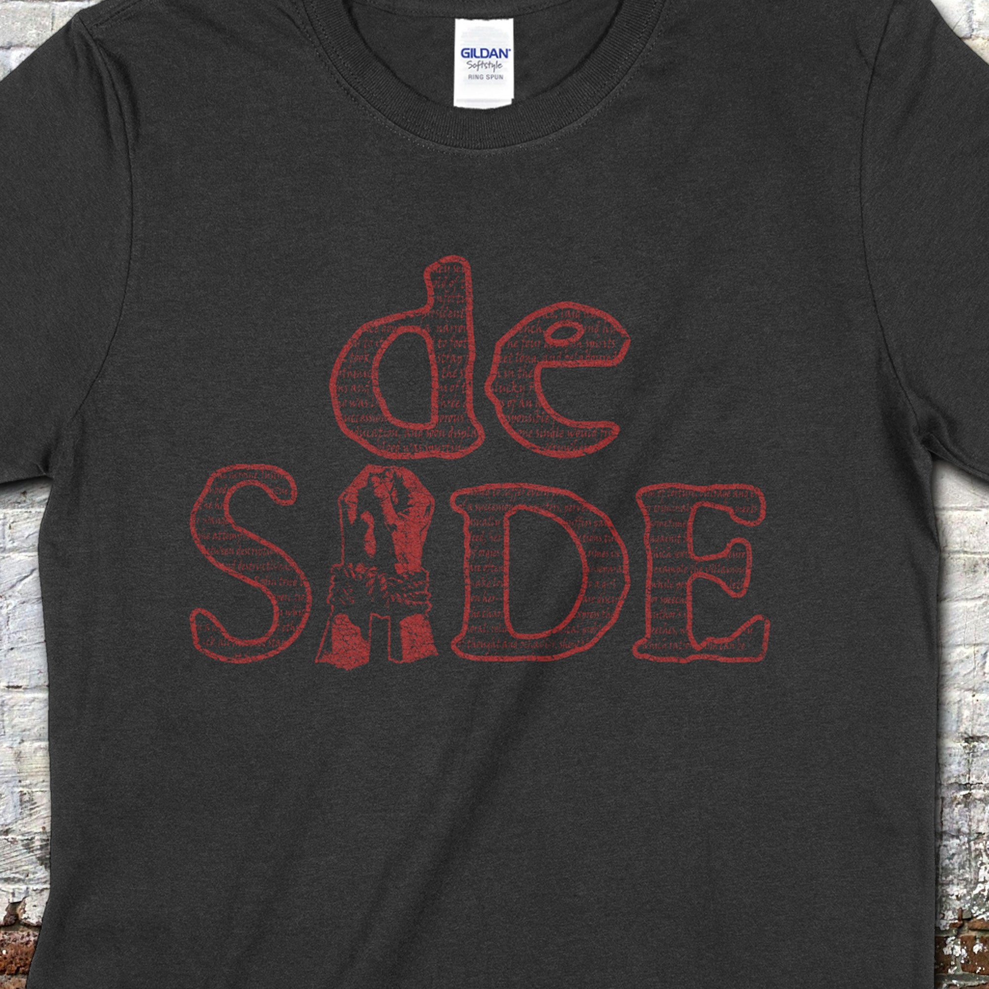 Marquis de Sade t-shirt in dark charcoal with distressed red text design inspired by classic literary style