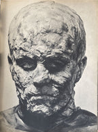 Black and white photograph of a mummified head with detailed texture.