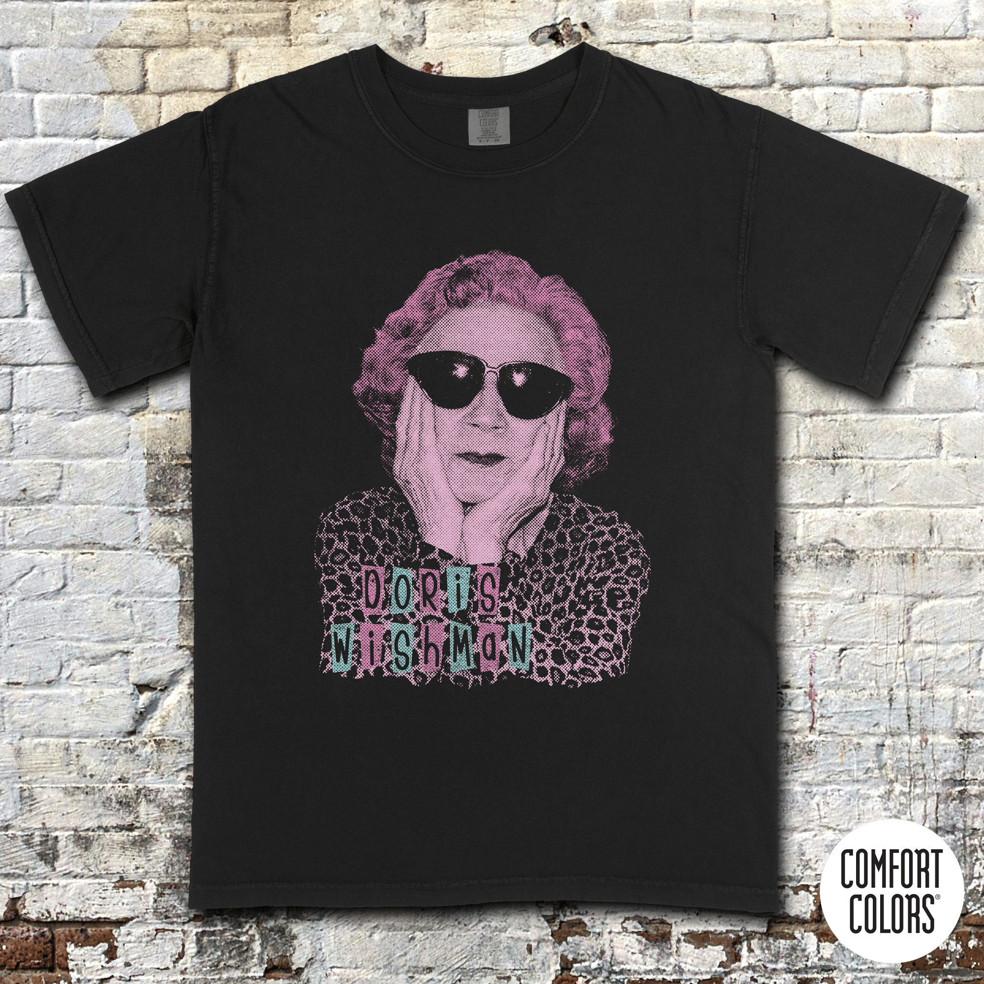 Doris Wishman t-shirt Design 2 featuring stylized portrait with sunglasses and vintage grindhouse lettering on black shirt