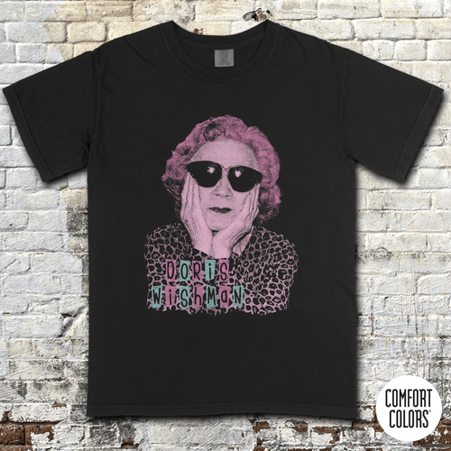 Doris Wishman t-shirt Design 2 featuring stylized portrait with sunglasses and vintage grindhouse lettering on black shirt