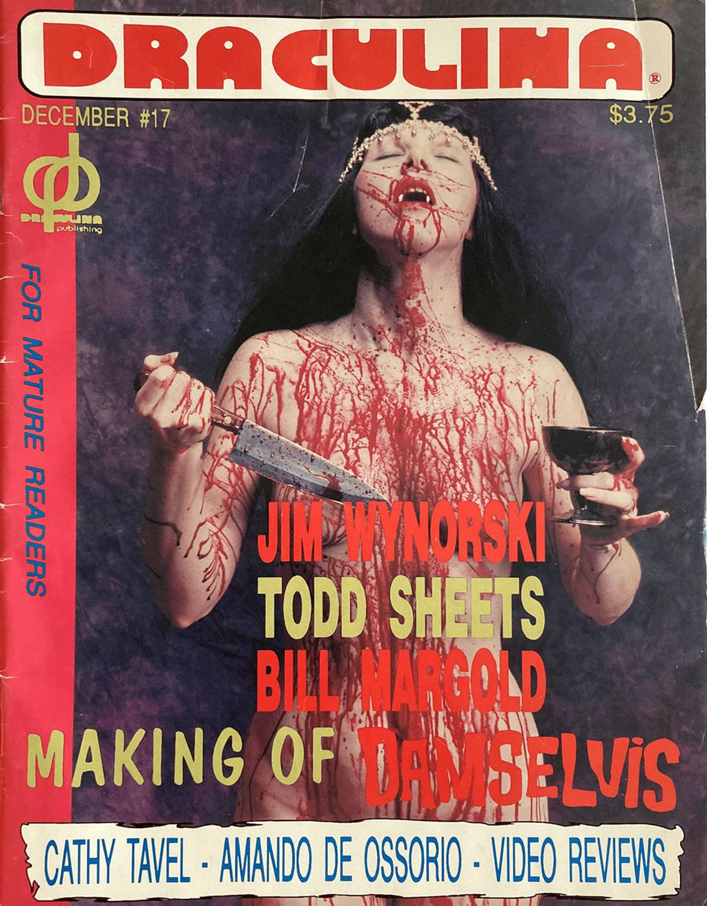 Magazine cover titled 'Draculina' with a bloody woman holding a knife and glass, featuring text about contributors and topics.