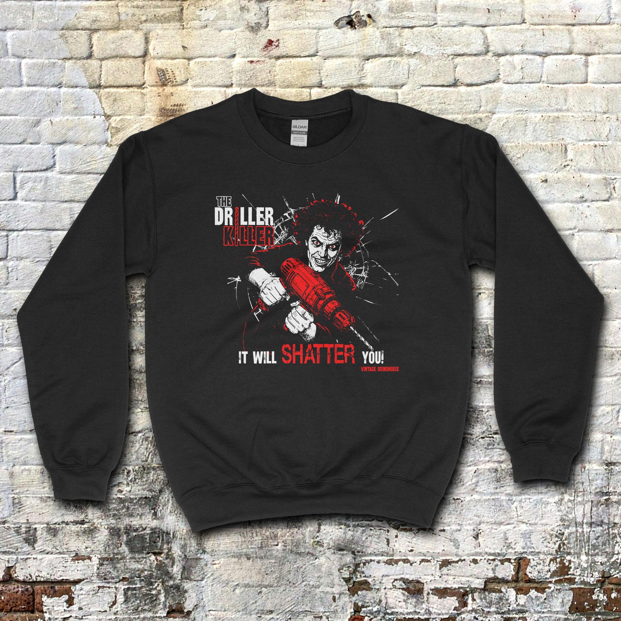 The Driller Killer sweatshirt with intense graphic of man holding red power drill and shattered glass effect on black fabric