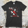 Black t-shirt featuring a graphic of a man with wild hair holding a red drill with The Driller Killer and shattered glass text on front