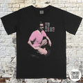 Ed Wood t-shirt featuring a vintage-style black tee with a pink graphic of Ed Wood and retro text blocks.