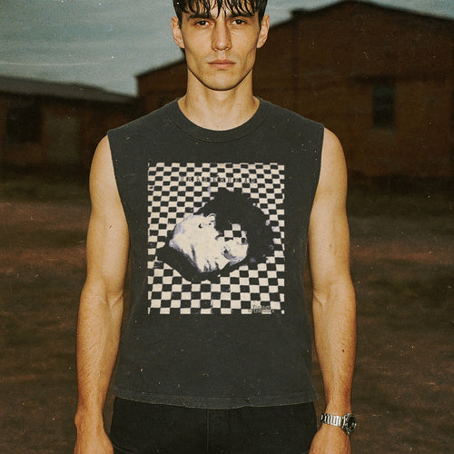 Eraserhead muscle tank featuring a black-and-white distorted face graphic over a checkerboard pattern on dark fabric