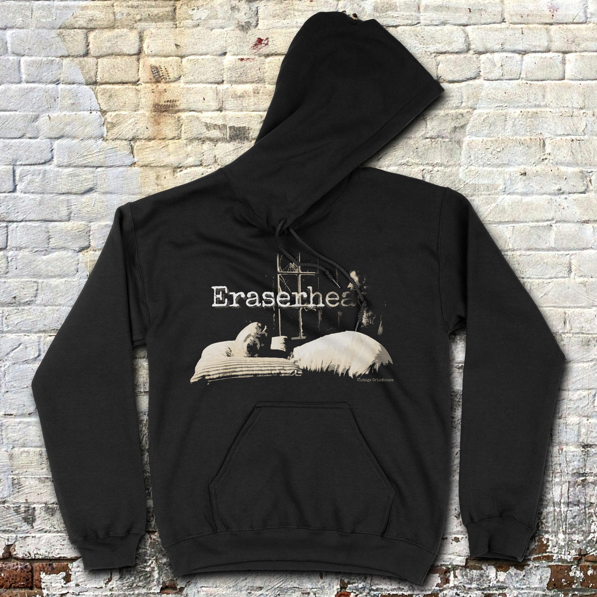 Black Eraserhead Baby hoodie with vintage film scene and bold text laid flat against rustic brick wall background