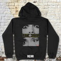 Black hoodie with 'EYEBALL' graphic design on a textured wall background