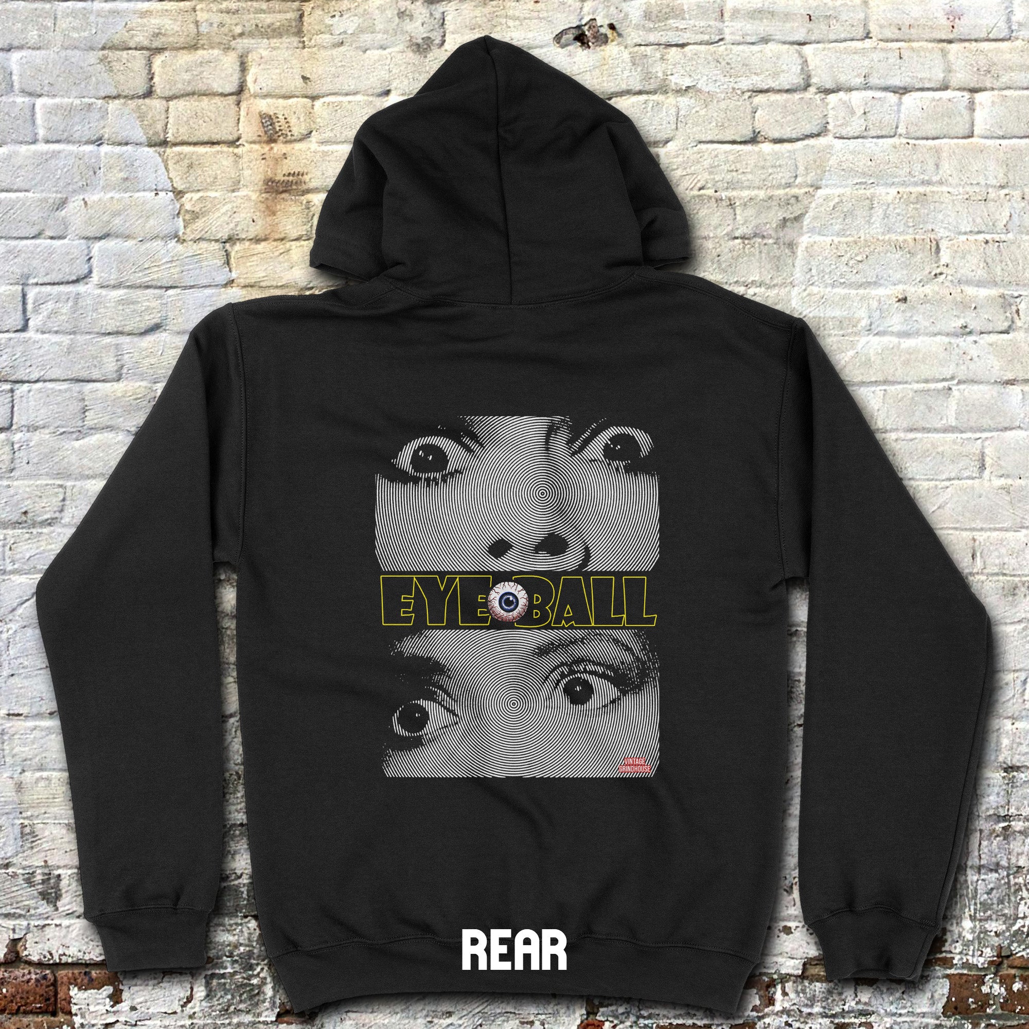 Black hoodie with 'EYEBALL' graphic design on a textured wall background