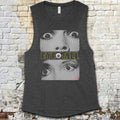 Eyeball muscle tank with hypnotic black-and-white close-up eyes graphic and bold yellow text on dark fabric