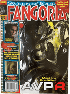 Magazine cover featuring a PredAlien from AVPR with movie posters on the left side.