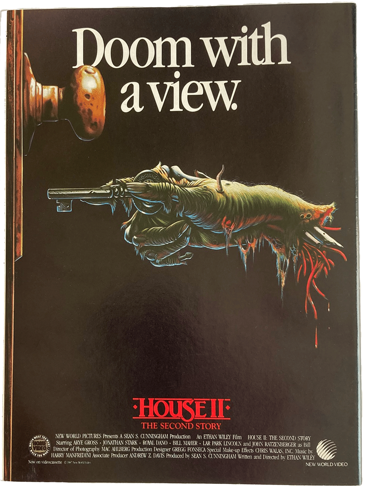 Promotional poster for 'House II: The Second Story' with a hand holding a key and text 'Doom with a view'.
