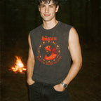 Häxan - Witchcraft Through the Ages muscle tank with vintage red occult graphic worn by model outdoors at night