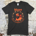 Black t-shirt featuring a red vintage graphic of a horned figure with Häxan text and circular occult symbols on front