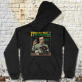 Black Herbert West, Reanimator hoodie with colorful vintage comic cover print on back against white brick wall