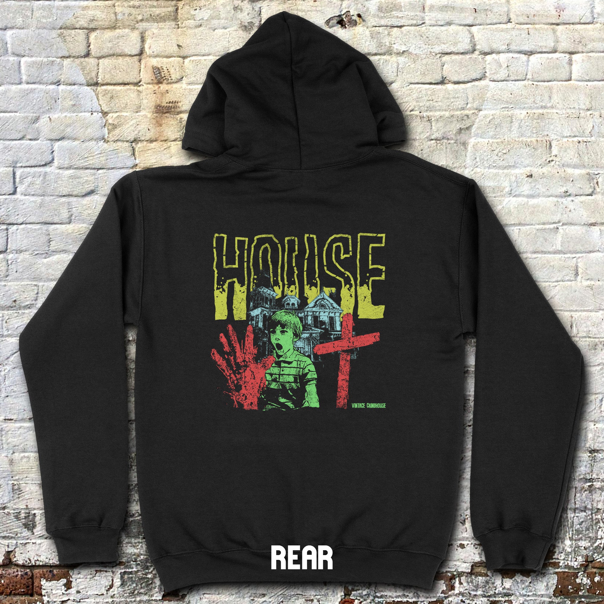 House hoodie (rear print) with vintage horror-style design featuring distressed text, haunted house, handprint, and eerie character in green and red