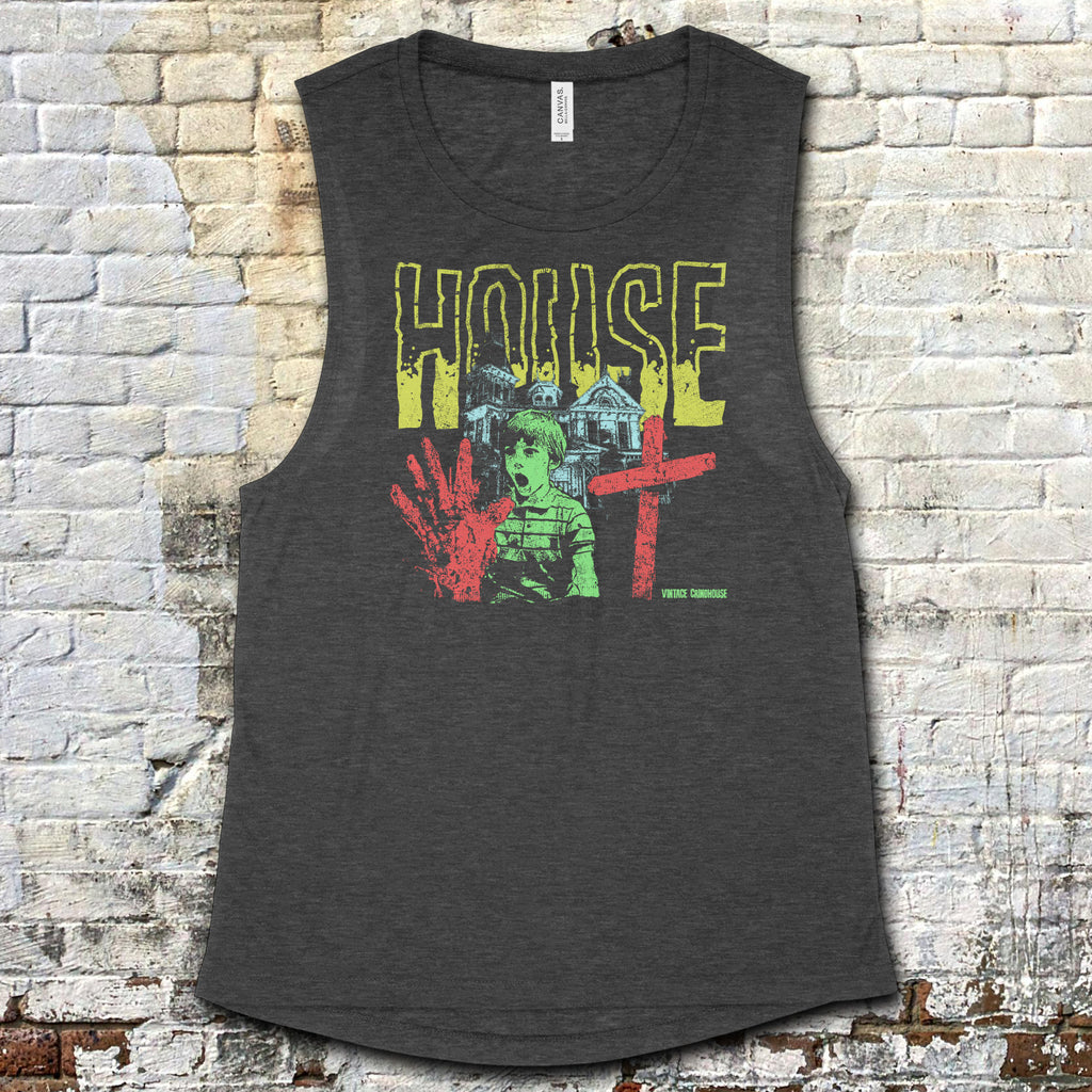 House muscle tank with vintage horror-inspired graphic of shocked boy, bloody hand, and gothic house on dark fabric