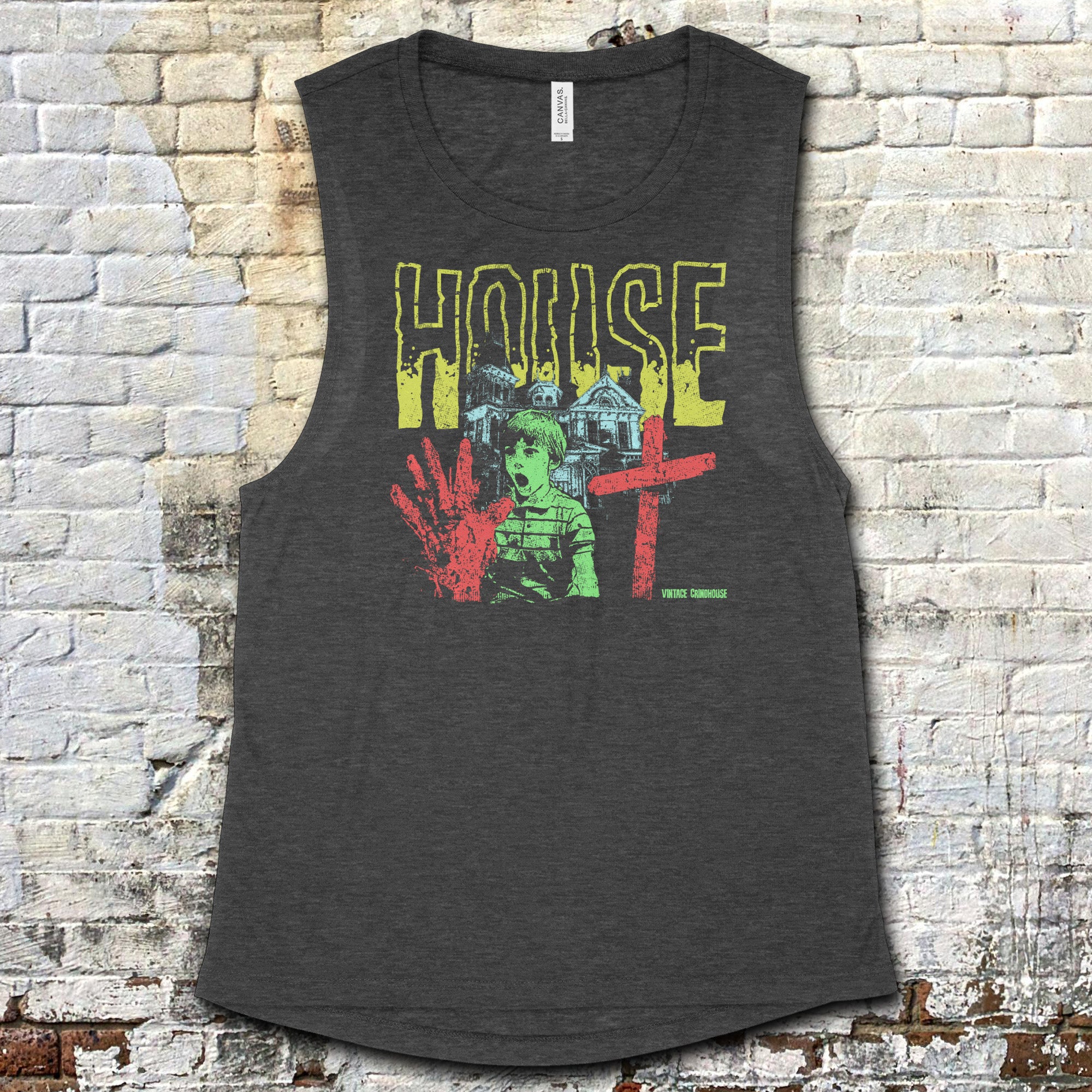 House muscle tank with vintage horror-inspired graphic of shocked boy, bloody hand, and gothic house on dark fabric