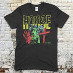 Black t-shirt featuring a distressed yellow House text with a haunted house, boy, bloody handprint, and red cross graphic on front