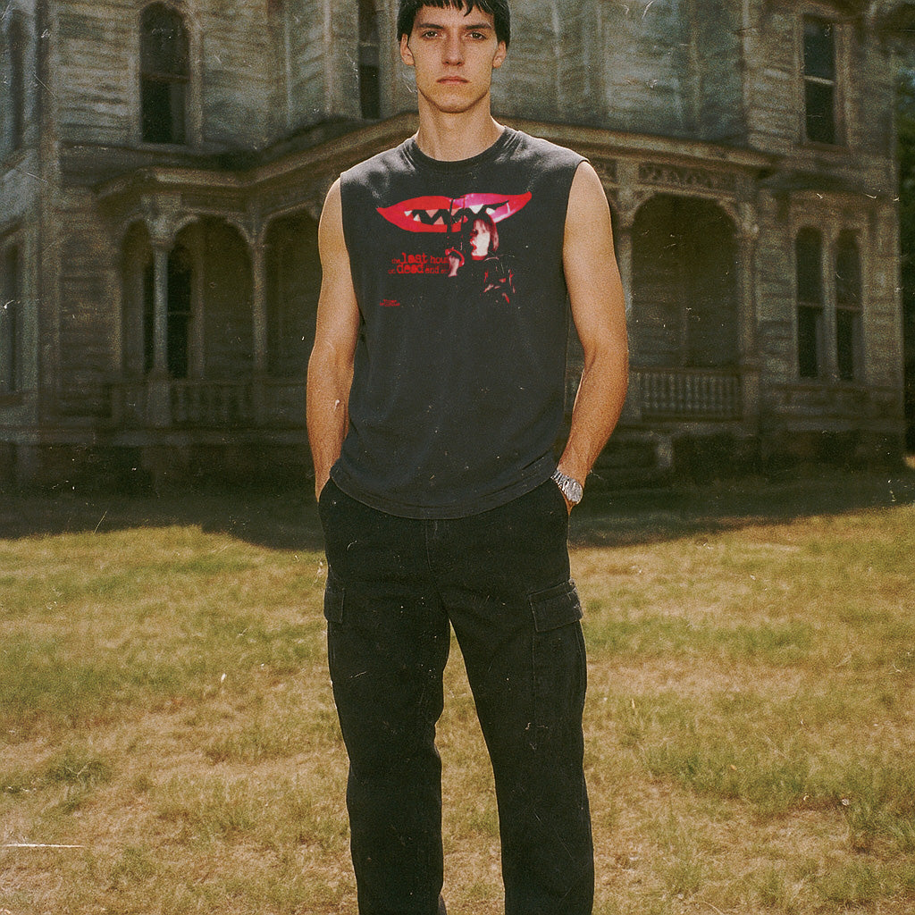 Last House on Dead End Street muscle tank with eerie red lips and dark figure graphic on black sleeveless top