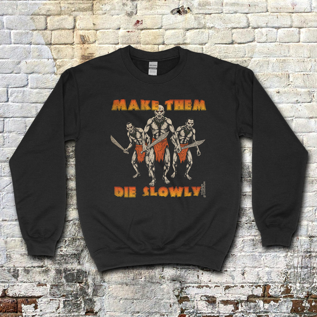 Make Them Die Slowly sweatshirt with three warriors in loincloths holding swords and bold distressed text on black fabric