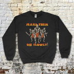 Make Them Die Slowly sweatshirt with three warriors in loincloths holding swords and bold distressed text on black fabric