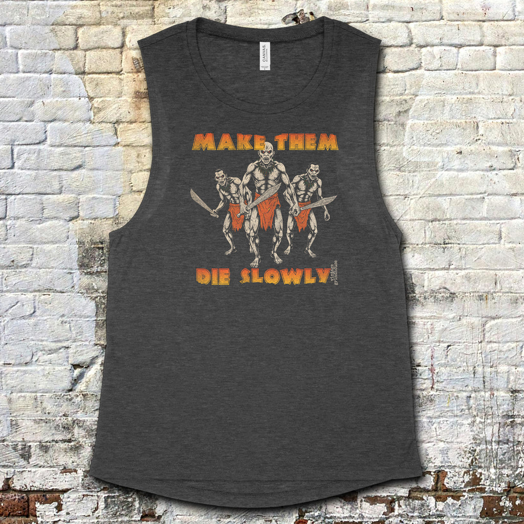 Make Them Die Slowly muscle tank with fierce warrior trio graphic and bold orange text on dark charcoal fabric