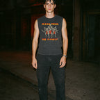 Make Them Die Slowly muscle tank with retro horror graphic of three combat figures in red and white on dark fabric